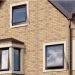 House with grey AluK windows Forres - Cathedral Windows